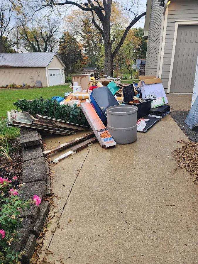 Dumpster being loaded with debris for 3 Yard Dumpster Rental in West New York